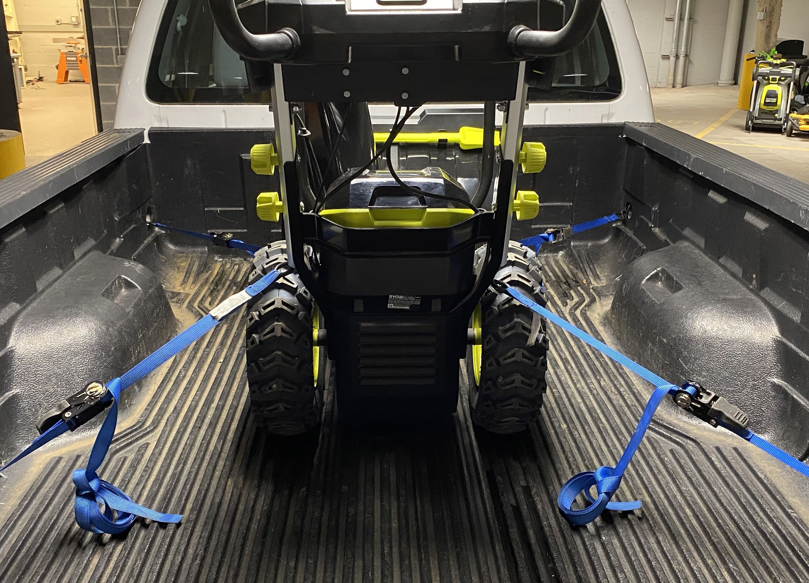 Straps securing small vehicle